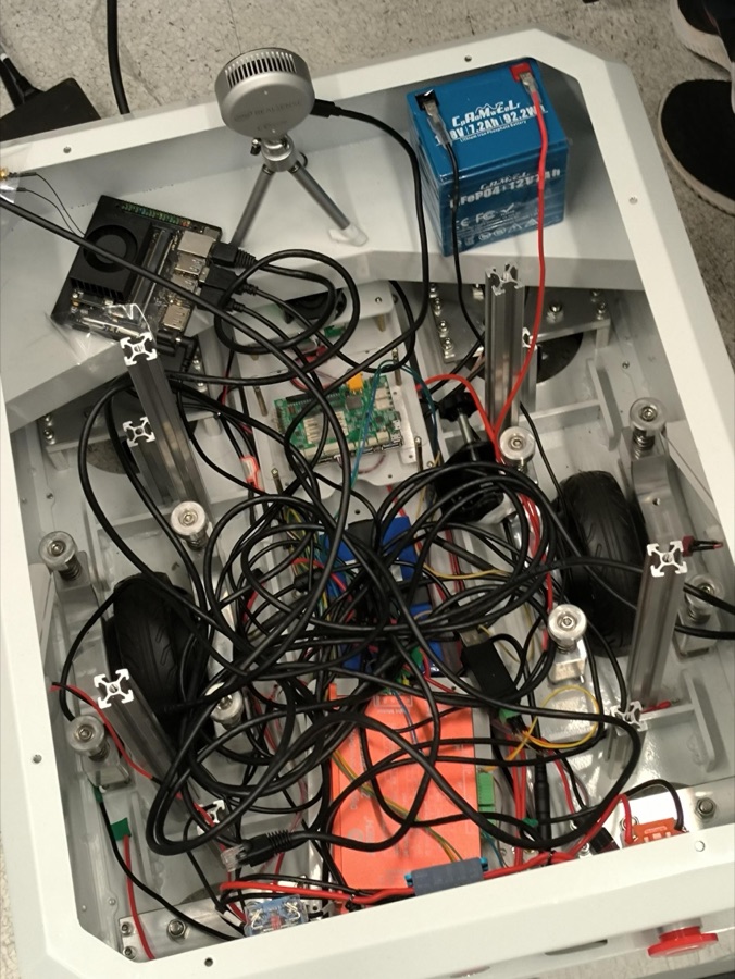 Opened mobile base chassis: battery, motor drives, communication wiring, Jetson, RealSense